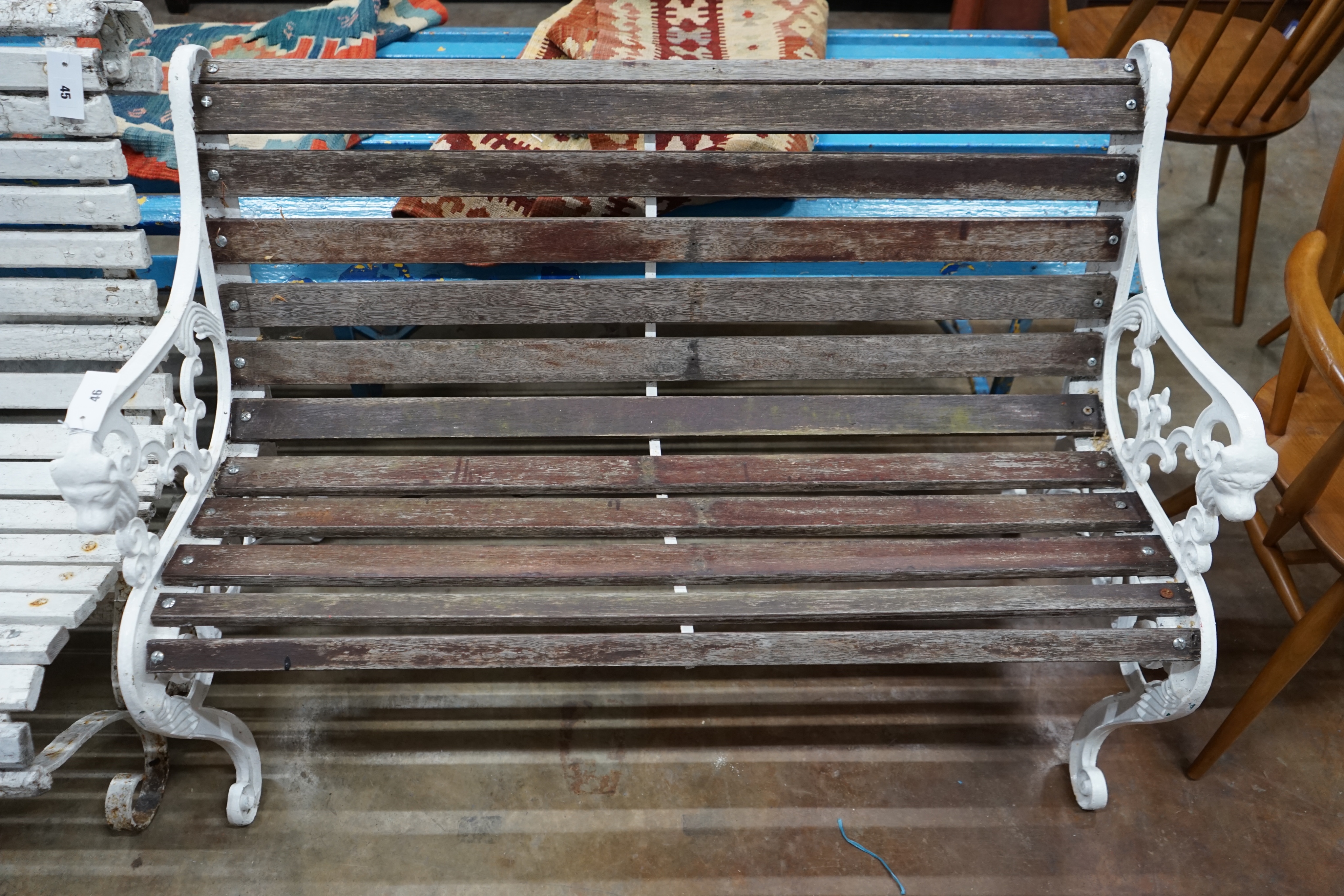 A Victorian style painted slatted wood garden bench, length 117cm width 60cm height 78cm